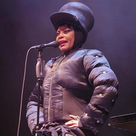 Erykah Badu performing on tour